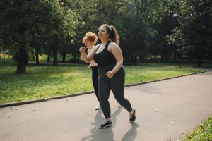 Women jogging in plus size activewear