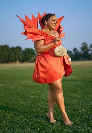 Lady wearing a beautiful orange  dress