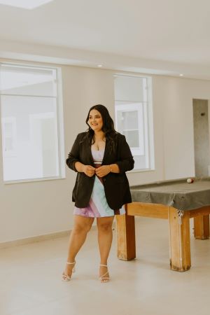 Lady in skirt and a black  blazer