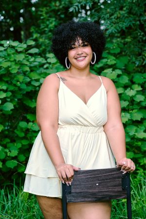 Lady in stylish cream dress summer brand.