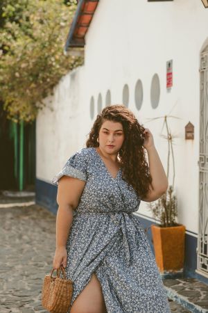 Plus size lady wearing a wrap dress.